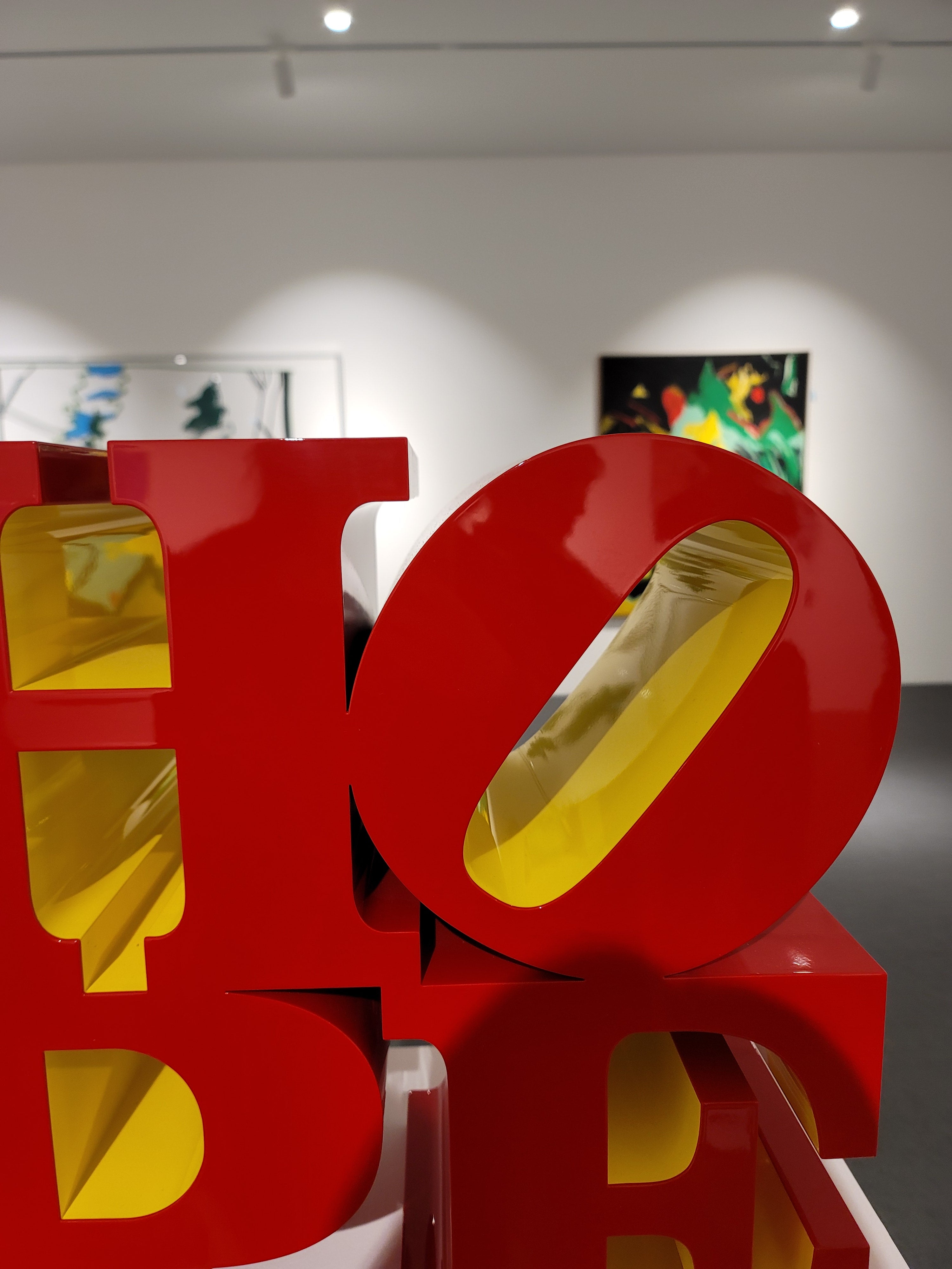 Side view of Robert Indiana HOPE Red Yellow sculptural multiple"
