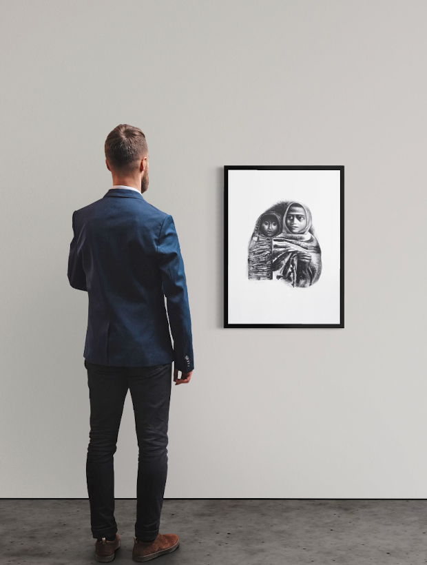 <img alt="Installation view of Elizabeth Catlett's Rebozos, framed work hanging on a white gallery wall, with a visitor standing with their back to the camera contemplating the piece." />