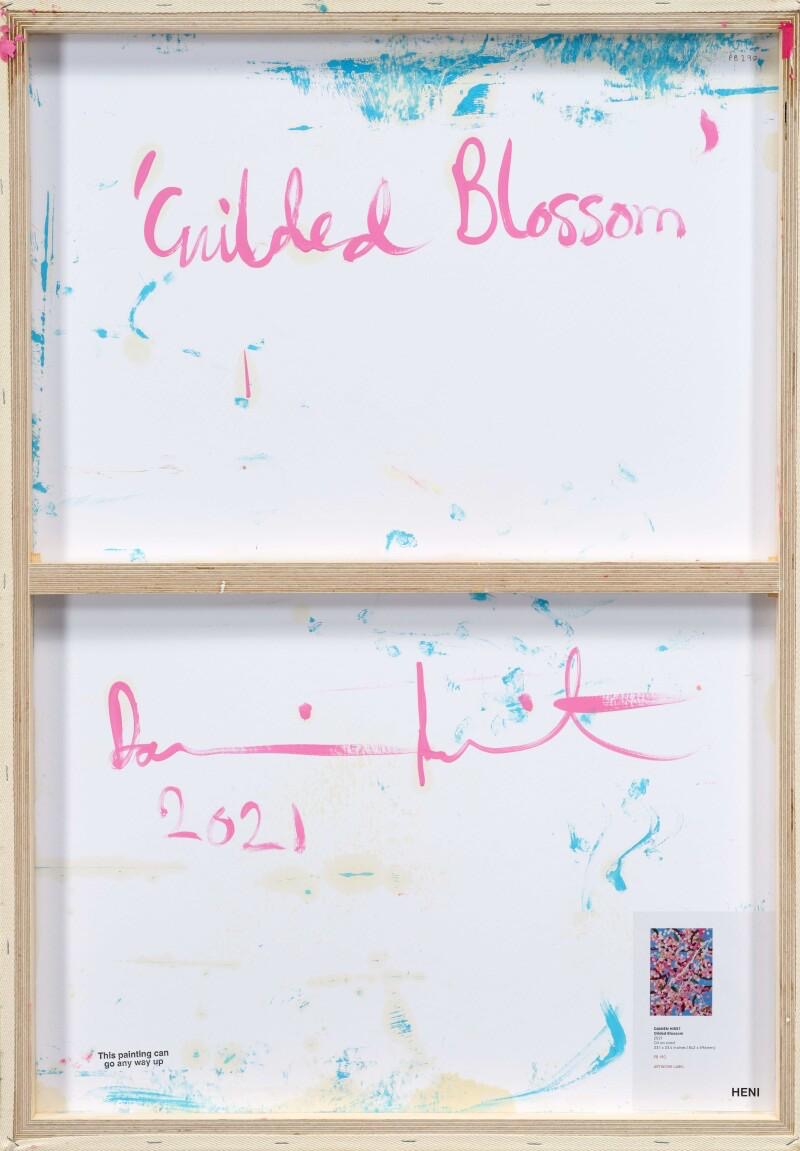 <img alt="Reverse of Damien Hirst's Gilded Blossom showing the artist's handwritten signature, title and date 2021, along with accompanying authentication documentation." />