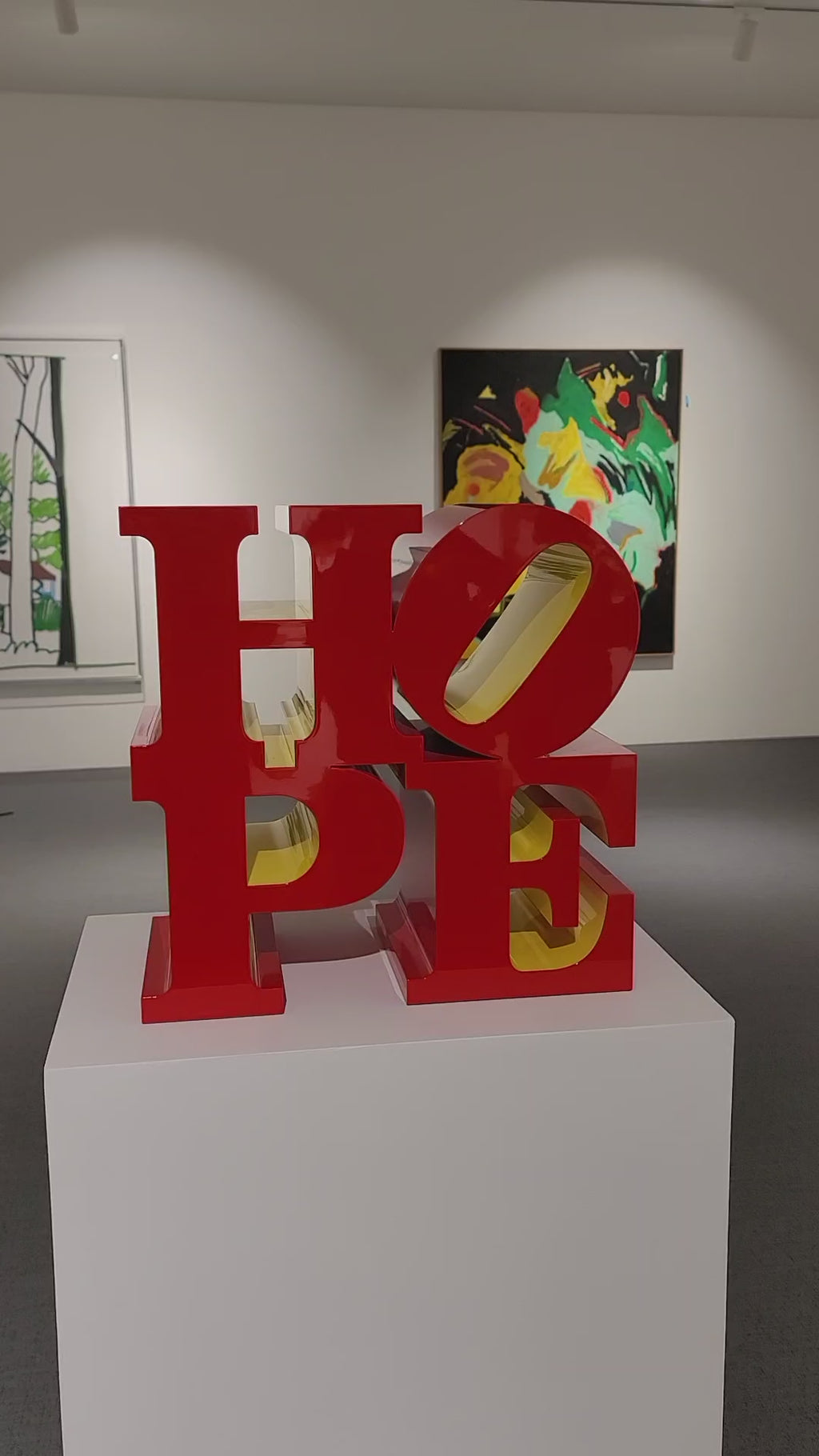 Side view of Robert Indiana HOPE Red Yellow sculptural multiple"
